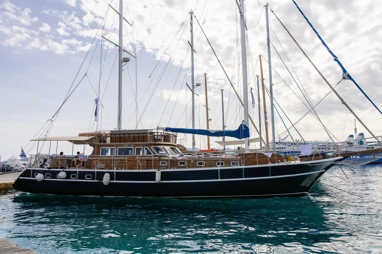 Aerial view of guests relaxing on the sun deck as the boat rests at sea
